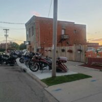 Motorcycle parking outside of the bar.